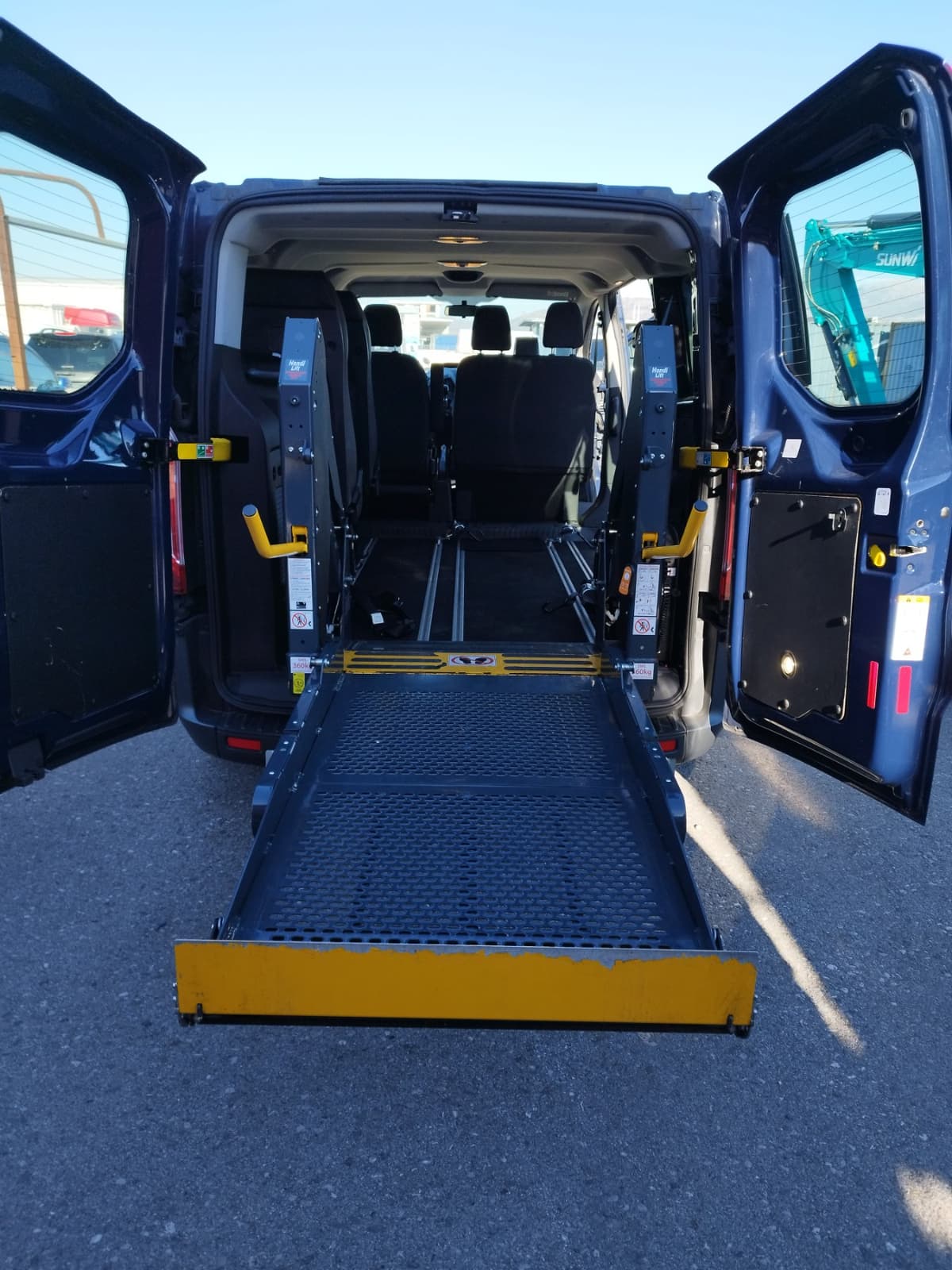 Wheelchair accessible van with a ramp deployed